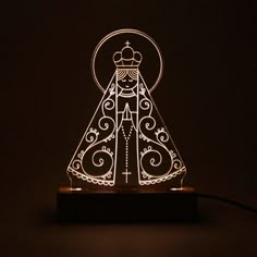 a light that is sitting on top of a wooden stand with a princess in it