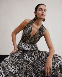 Cut from our beloved mesh, the Drew maxi dress has a soft and stretchy feel. This sleeveless wrap dress has a V-neckline, a matching tie that cinches the waist and a criss-cross back. As part of our limited-edition 50th anniversary capsule, this reversible wrap showcases the Six Sister Camo print on one side and our revived Python print in brown on the other. If you prefer a snug fit consider sizing down, as our mesh has extra stretch for extra comfort. Paulina is 5 Foot 11 Inches and wearing a Six Sister, Wrap Dress Dvf, Ladies Day Dresses, Sleeveless Wrap Dress, Purple Midi Dress, Python Print, Mini Tank Dress, Silk Midi Dress, Silk Maxi Dress