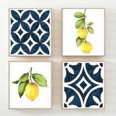 four lemons are hanging on the wall with blue and white geometric tiles behind them