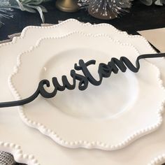 a white plate with the word custom on it