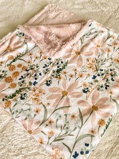 a blanket that has flowers on it