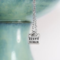 Wear this tiny little brave necklace to remind yourself to be brave....and never give up. How can we be more brave? I find it's best to take stock of where I'm at right now, and be willing to fail.7 12mm x 10mm Lead free pewter Hand stamped Choose your chain length Brave Necklace, Jewelry Care Card, Anchor Necklace, Human Hand, Hand Stamped Jewelry, Be Brave, Stamped Jewelry, Polish Jewelry, Never Give Up