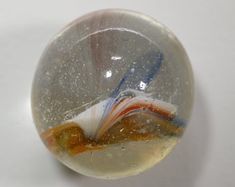 a glass ball with different colored lines in it