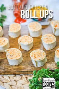 buffalo chicken roll ups on a cutting board