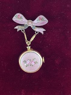 Vintage Harman Broach WW2 Boy Friend Pin with Bow Ribbon Watch  hand made Pink Guilloche Enamel with 2 Roses Pin Bow also with small rose buds Brooch Pin 1.25 inches wide 2 inches tall inch Bow and watch is 7/8 inch in diameter. This is Hand made from the 40's Harman 7 Jewel Movement Manual watch in a Bronze 12K Karat Gold plated  known as a boy friend pin during WW2 Vintage Harman Watch Not working hand made Guilloche Enamel with Pink Roses Balance ticks for a few seconds, balance does turn fre Ribbon Pin, Guilloche Enamel, Pink Aura, Bow Ribbon, Neck Jewellery, Small Rose, Jewelry Lookbook, Fantasy Jewelry, Girly Jewelry