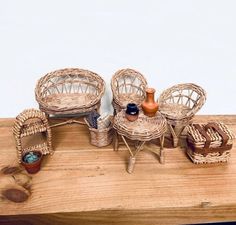 wicker furniture is displayed on a wooden table