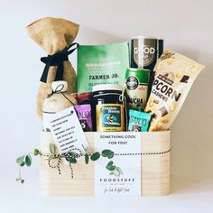 a basket filled with lots of goodies next to a sign that says something cool for you