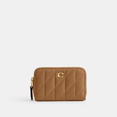 Crafted of quilted plush ultra-soft leather this case holds cards cash and other small essentials in a slim design that slips easily into pockets. Detailed with our Signature hardware the accordion gusseted design secures with a zip-around closure. | Coach Essential Small Zip Around Card Case With Pillow Quilting - Women's - Brass/honey Brown Hobo Crossbody Bag, Woman Card, Backpack Charm, Honey Brown, Signature Hardware, New Handbags, Nappa Leather, Slim Design, Card Case