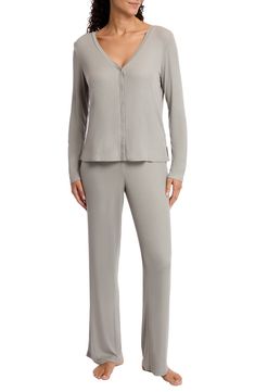 Lounge or sleep in ultimate comfort in these long-sleeve henley pajamas crafted from softly ribbed knit fabric. Top has front button closure; V-neck; long sleeves Pants have elastic waist 95% Lenzing Ecovero, 5% spandex Lenzing EcoVero viscose is a more-sustainably produced fiber made using pulp made from renewable wood sources Machine wash, tumble dry Imported Brooks Running Shoes Women, Knit Pajamas, Ribbed Knit Fabric, Work Sweaters, Brooks Running Shoes, Sweaters And Leggings, Sleepwear Robe, Comfortable Sandals, Kids Pajamas