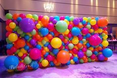 a large number of balloons in the shape of a wall