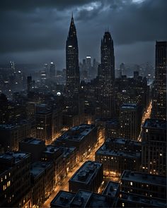 an aerial view of the city at night with buildings lit up and dark clouds in the background