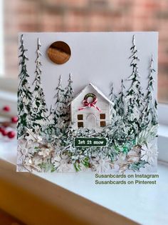 a christmas card with a house on it