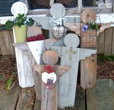 an old chair is decorated with flowers and other things to decorate on the front porch