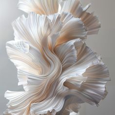 a large white flower sitting on top of a table