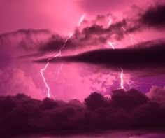 a purple sky filled with lots of lightning