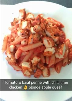 a white plate topped with pasta covered in sauce