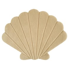 the scallop shell rug is beige and has five large shells on each side