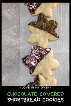 chocolate covered shortbread cookies are arranged in the shape of hats and stars, with text overlay that reads love in my oven