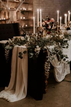 a table with candles and flowers on it