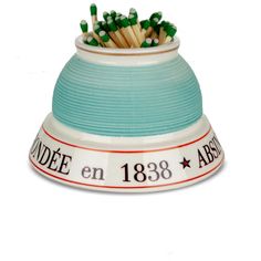 a ceramic bowl with matches in it and the words nadde en 1388 above it