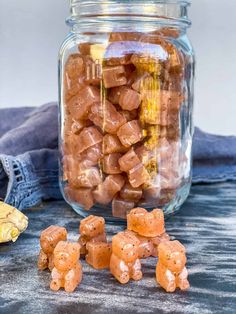 a jar filled with candy sitting on top of a table