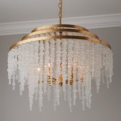 a chandelier hanging from the ceiling in a room