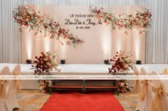 the wedding stage is decorated with flowers and ribbons