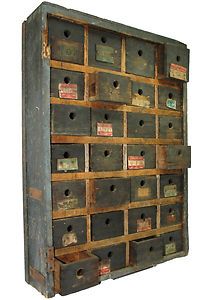 an old wooden box with lots of drawers