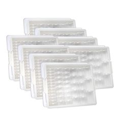 six white plastic trays with clear lids