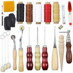 various sewing tools and thread spools on a white background