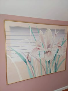 a painting hanging on the wall in a room