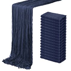 an image of a stack of blue towels on a white background, with one folded up and the other unzipped