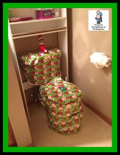 two wrapped presents sit in the corner of a closet