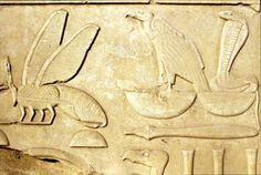 an egyptian bask with birds and other things on it