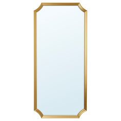 a gold framed mirror on a white wall