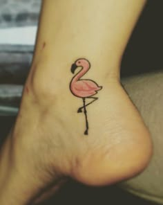 a small flamingo tattoo on the ankle