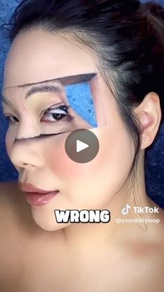 a woman with her face painted to look like an arrow and the words wrong on it