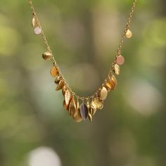 ENGLAND - With a detailed, sculptural approach to designing her jewelry, Sia Taylor draws inspiration from the infinitely tiny forms and organic irregularity of the natural world. Seeds, raindrops, grasses, and leaves reappear in a golden interpretation - celebrating the miniscule and macroscopic. Every element is hand crafted in her Somerset studio resulting in a understated collection where 'every piece has to have a soul; it's important the jewelry retains its slow, quiet beauty '. Taylor Necklace, Somerset Studio, Rain Earrings, Trinity Necklace, Quiet Beauty, Dot Necklace, Zoe Chicco