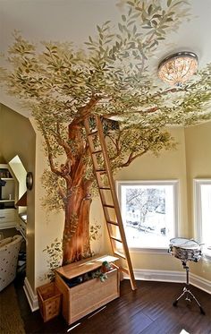 a tree painted on the ceiling in a child's room with a ladder up to it