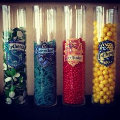 four different colored candy sticks lined up next to each other with harry potter logos on them