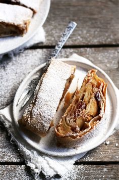 a white plate topped with a pastry cut in half