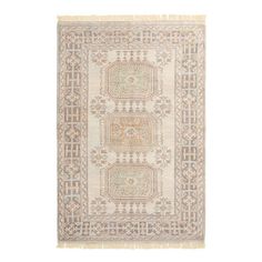 a beige rug with an intricate design on it