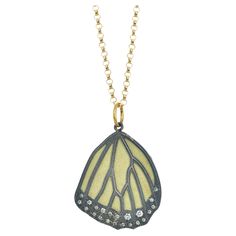 A true Rebecca Myers Design signature piece, our monarch butterfly wing designs are modeled after nature's masterpiece and hand crafted with the highest quality materials. Oxidized sterling silver is layered over 18k yellow gold, with sparkling pave set white diamonds at the bottom. The pendant hangs from a 16-inch 14k gold cable chain (other lengths available upon request; possibly subject to a price change.) This pendant design is also available in a smaller size. Check out our storefront to s Wings Design, Wing Necklace, Butterfly Wing, Nature Inspired Jewelry, Baltimore Md, Inspired Jewelry, Fine Jewelry Designers, Monarch Butterfly, Pendant Design