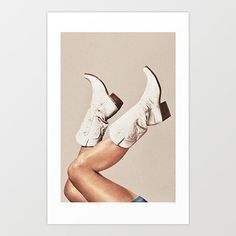 a woman's legs and white shoes with her leg up in the air art print