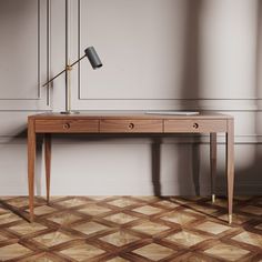 a wooden desk with a lamp on it