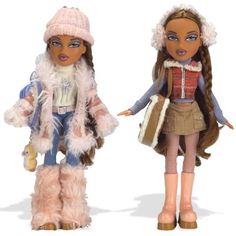 two dolls dressed in winter clothes and hats