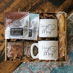 three coffee mugs in a box on a rug