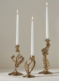 three candles are sitting next to each other