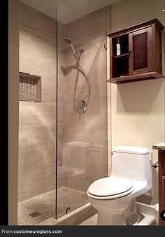 a bathroom with a shower, toilet and sink