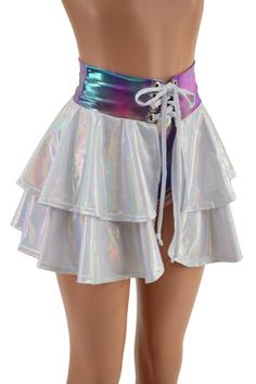 This 15" long circle cut skirt has a lace-up at the waistband, and a tiered ruffle, for double the cuteness.Both ruffles are created in our Flashbulb holographic spandex, with a Cotton Candy holographic waistband, and flashbulb lace up tie.Perfect for matching with our cheekies, shorts and crops, or wear it over leggingsThe skirt is open below the laceup, so be sure to wear something cute underneath! (or not? ;) )Womens Sizing (See below for instructions on where measurements should be taken)XXS Rave Skirt, Tiered Ruffle Skirt, Blue Skirt, Rave Outfits, Cotton Candy, Denim Dress, Lace Front, Ruffles, Cool Outfits